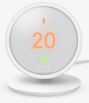 White Nest Thermostat E on its built-in stand, showing 20 degrees